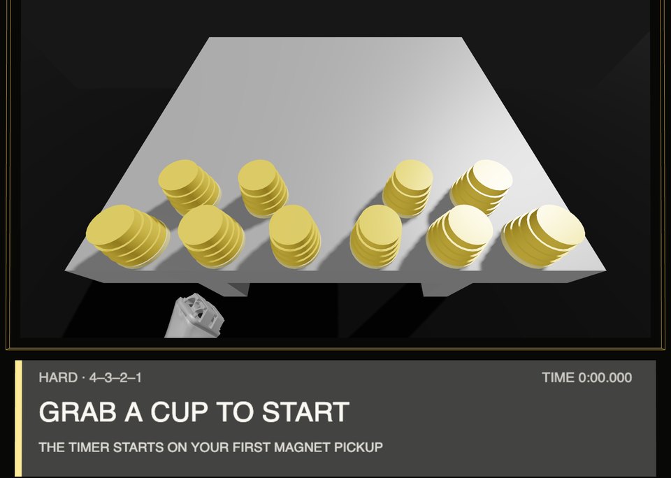 The headset before the first pickup: GRAB A CUP TO START, the timer starts on your first magnet pickup